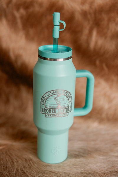 A light turquoise, plastic, 40-Ounce Capacity Custom Broker Leather Insulated tumbler.