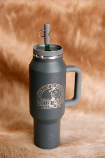 A charcoal grey, plastic, 40-Ounce Capacity Custom Broker Leather Insulated tumbler.