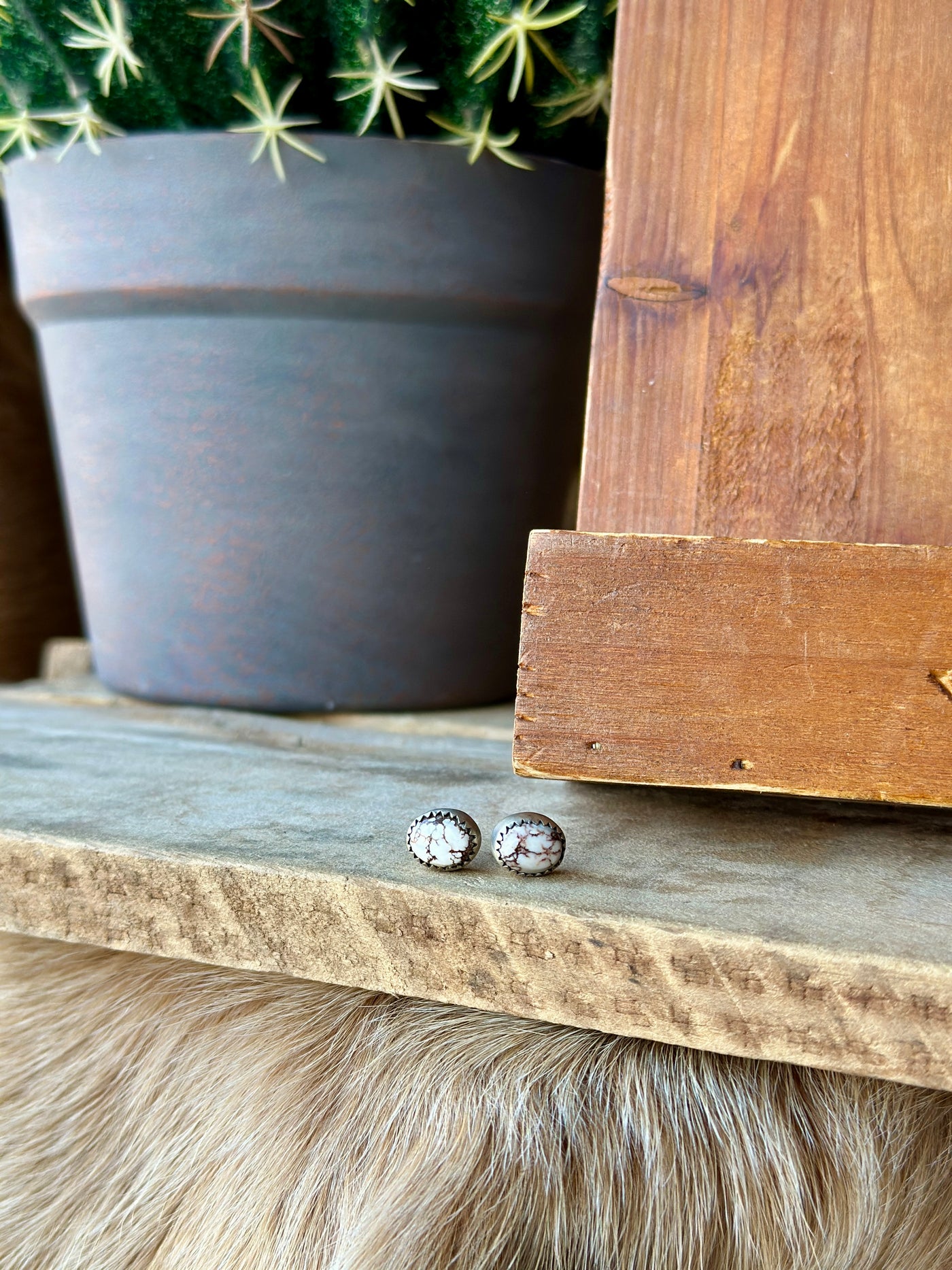 Dutton Wild Horse Stud Earrings featuring vibrant turquoise stones set in sterling silver, designed for a bold and modern cowgirl look.