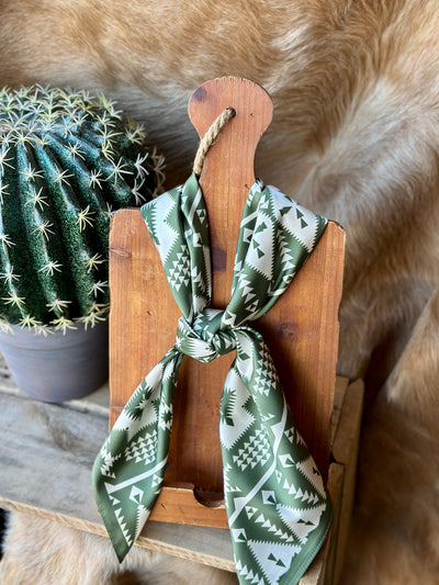 Broker Leather's Boho-chic Duvall Aztec Wild Rag in cream and olive green with a bold, retro-inspired Aztec design.