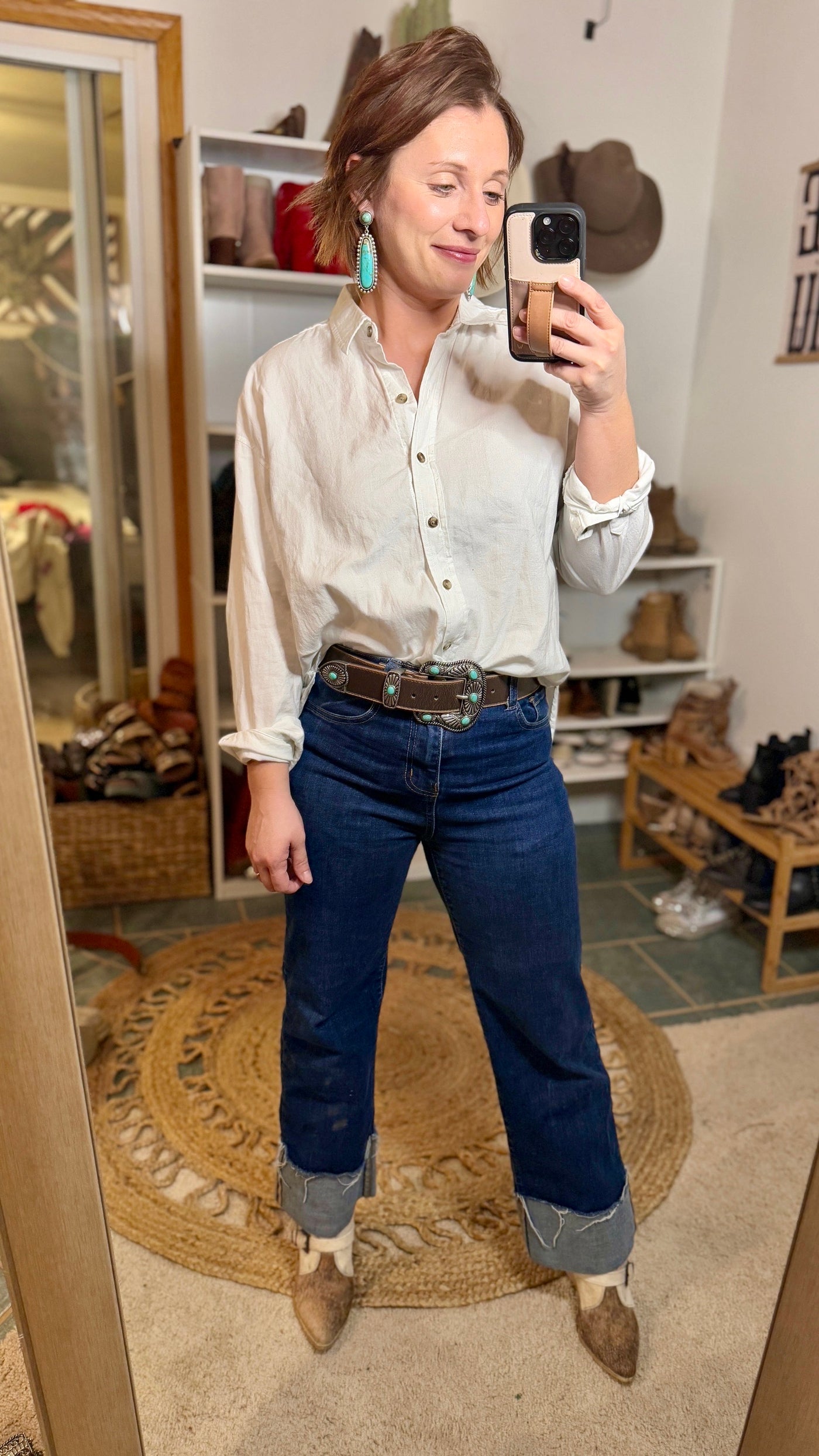 Rugged Yet Stylish Brown Leather Belt with Silver and Turquoise Details paired with classic denim and a white button down.