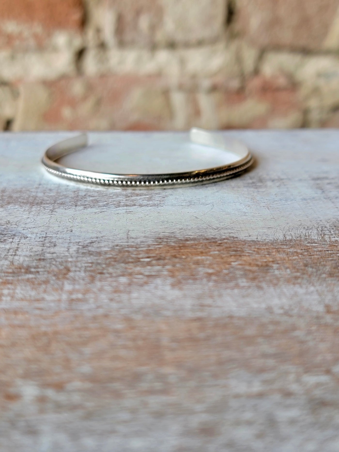 Minimalist Sterling Silver Cuff Bracelet with Beaded Edge Detail.