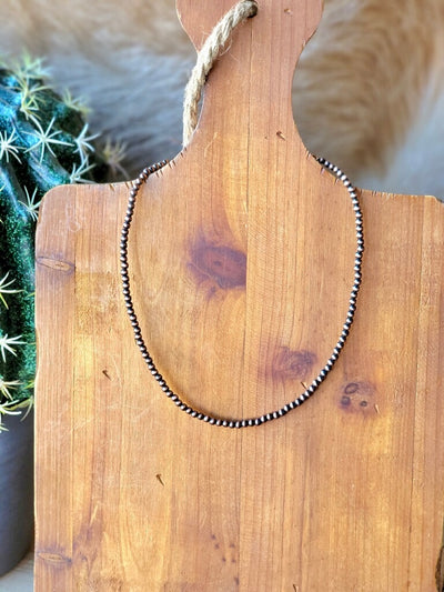 Western-style copper Navajo pearl necklace with adjustable extender.