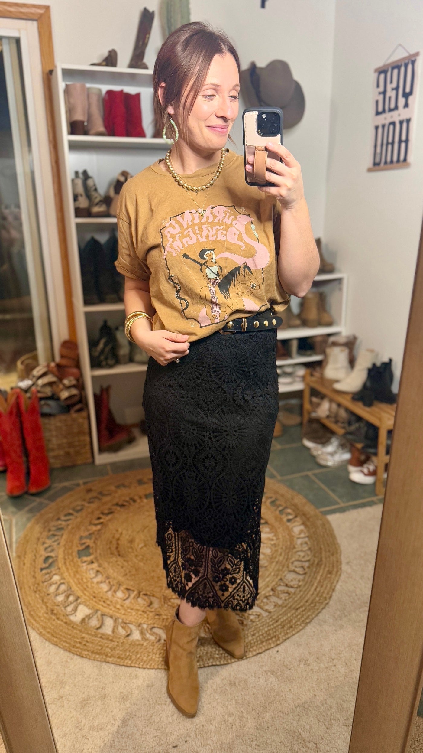 Edgewood Lace Midi Skirt featuring soft, flowing lace fabric paired with a simple mustard graphic tee and boots.