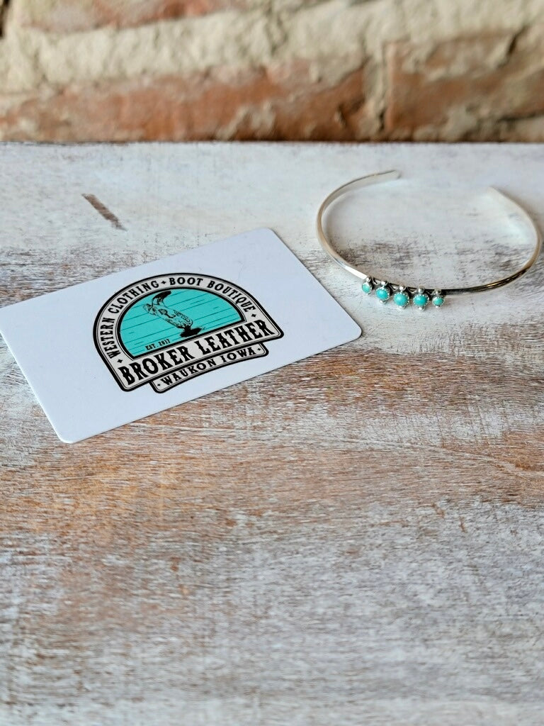 Delicate Turquoise Cuff Bracelet with Five Genuine Gemstones shown next to a plastic gift card for size reference.