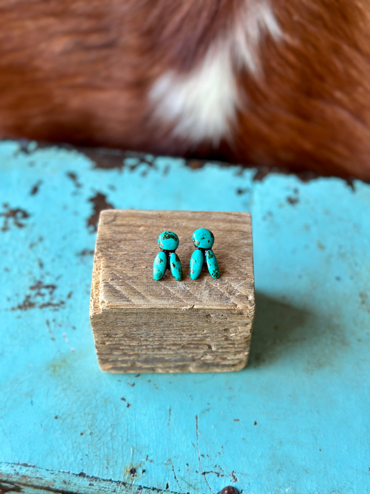 Euchre Turquoise Clay Stud Earrings photographed to emphasize their handcrafted charm and versatility.