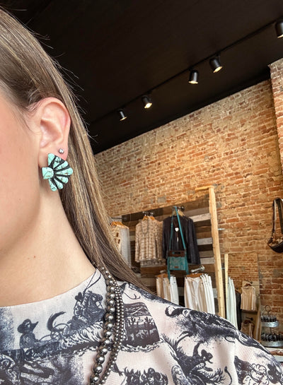 Model wearing the Ezra Clay Cluster Earrings to show size relevance, styled for a bold Western-inspired statement look.