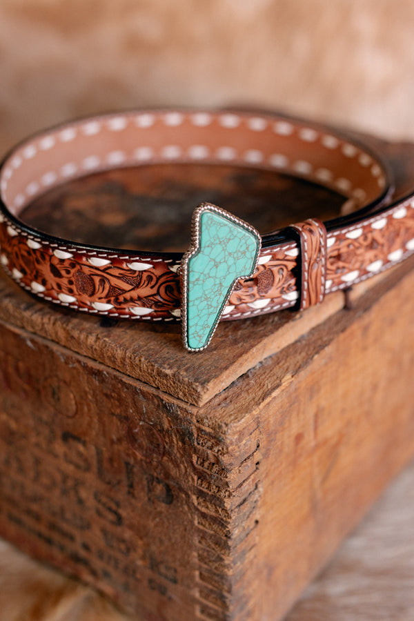 Flat lay of the Finley Ladies Lightning Bolt Belt in genuine leather, available in sizes S to XL from Broker Leather.