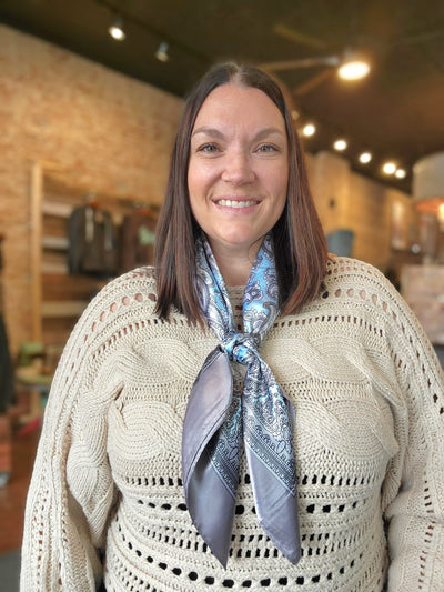 Woman modeling the Fiona Paisley Wild Rag [Baby Blue & Grey].