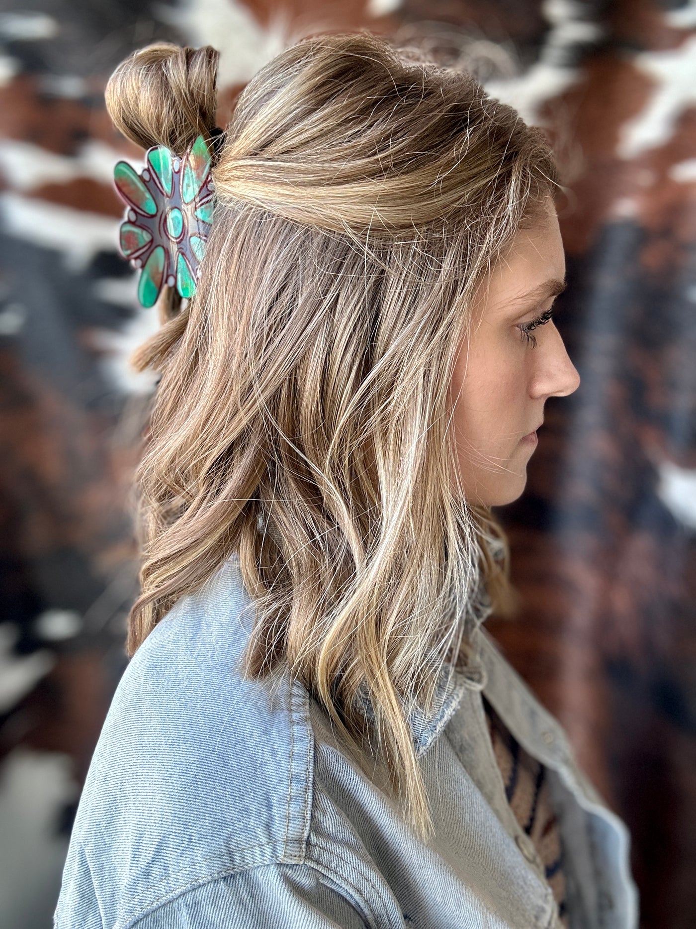 A woman modeling our Teri Turquoise Cluster Claw Clip in her hair.