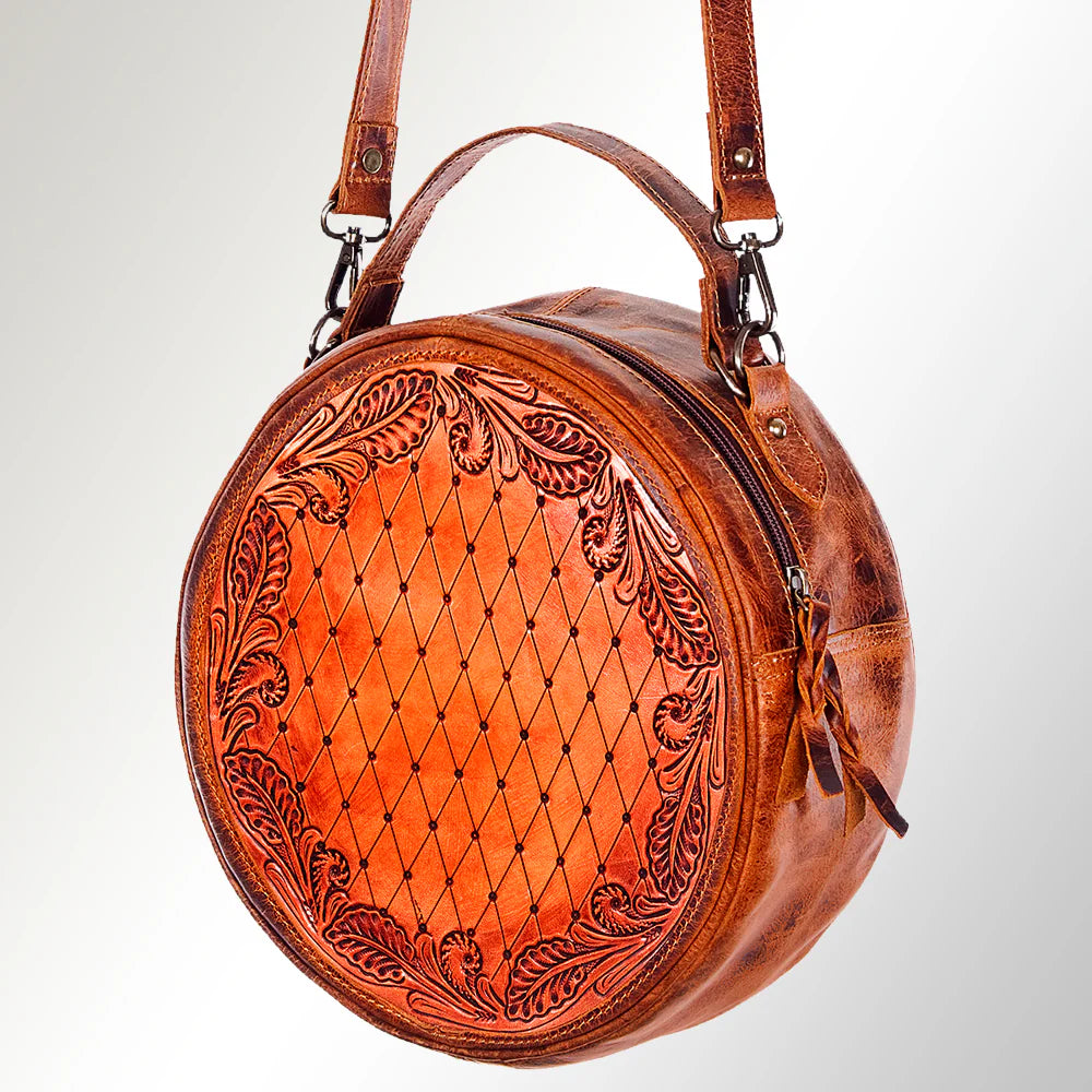 Clos.e-Up of Intricate Hand-Tooled Leather Detailing on Canteen Bag