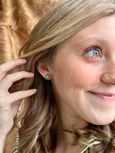 lose-up of Genette Turquoise Stud Earrings – Classic Western-Inspired Square Earrings modeled to show size relevance.