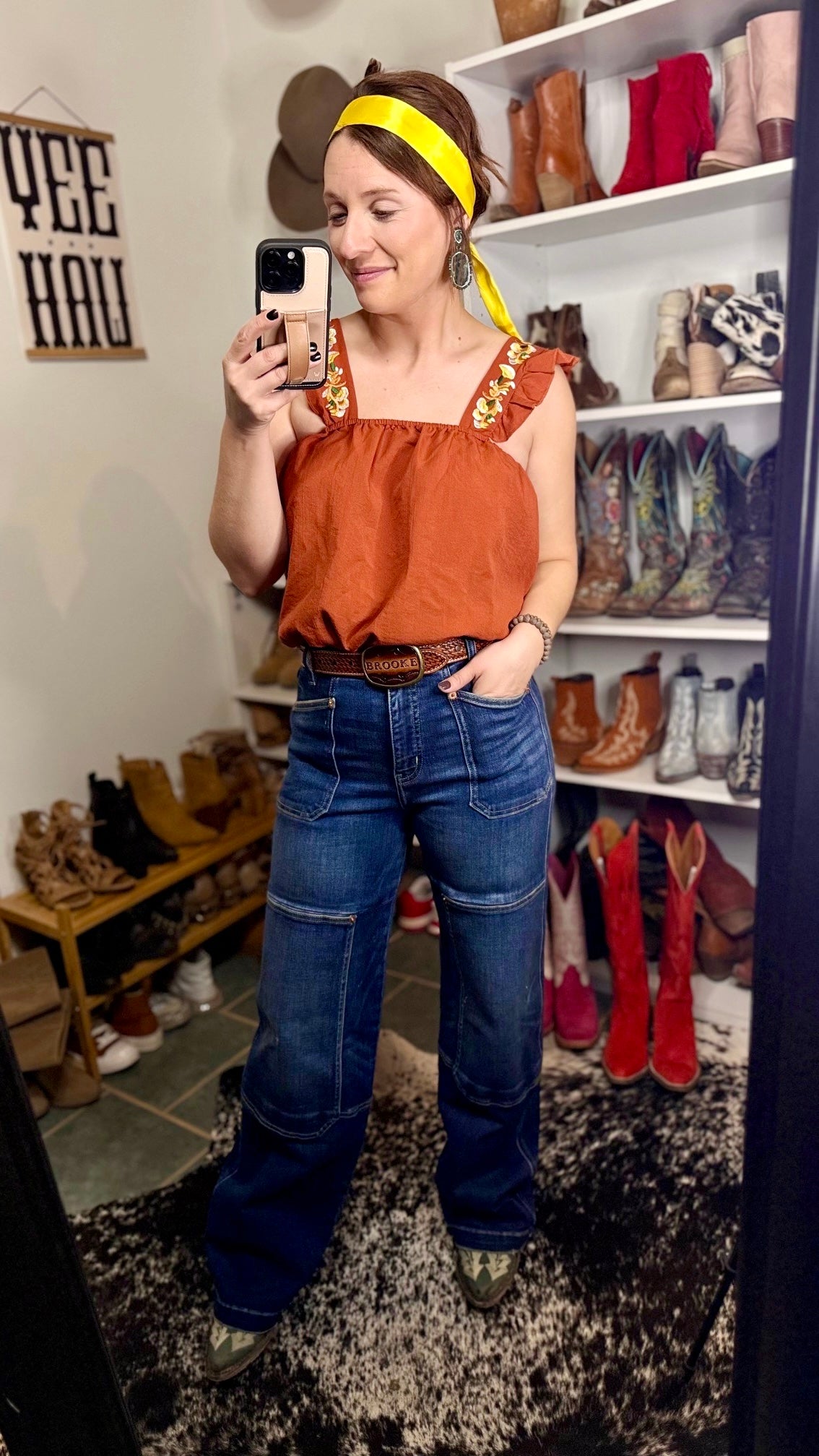 The Gertrud Embroidered Ruffle Sleeve Tank in Rust is perfect for any occasion, from rodeo nights to summer fairs, with its elegant and comfortable design.