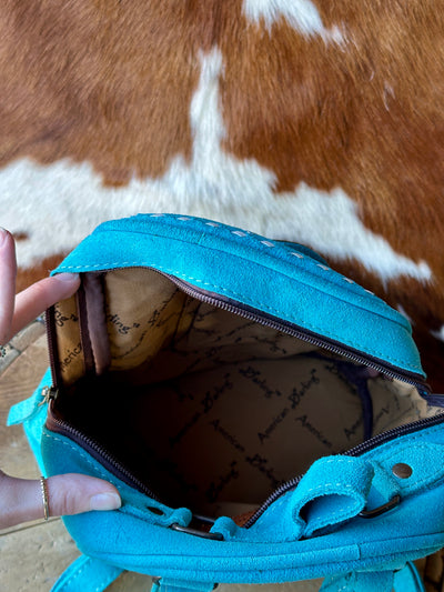 Fully lined, spacious Interior of Suede Backpack with Multiple Pockets.