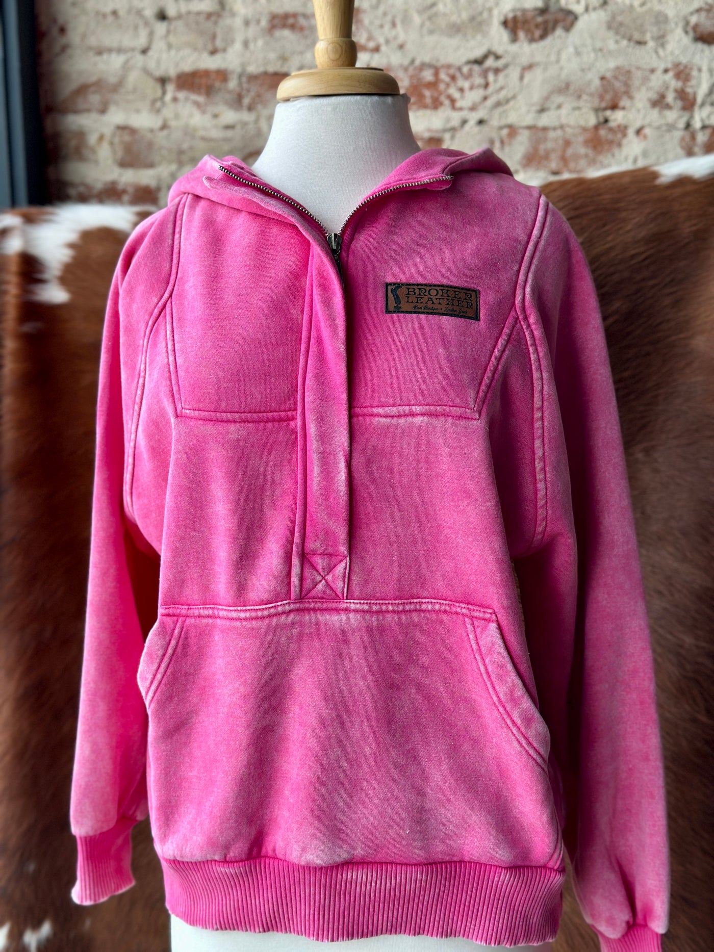 Grit & Glory Quarter Zip Sweatshirt in mineral-washed hot pink with custom leather Broker Leather logo.