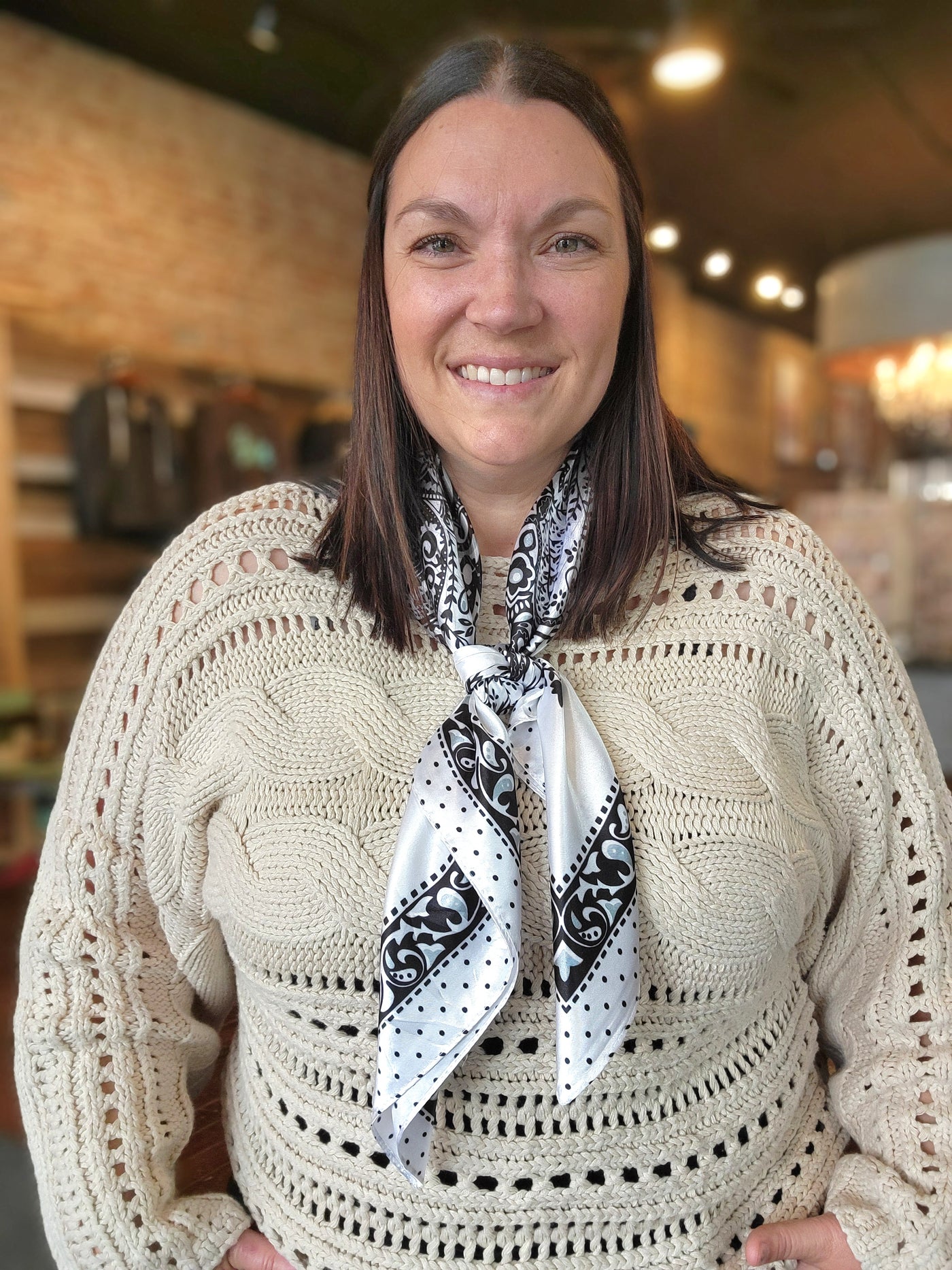 Woman modeling the Haddlee White Floral Wild Rag.