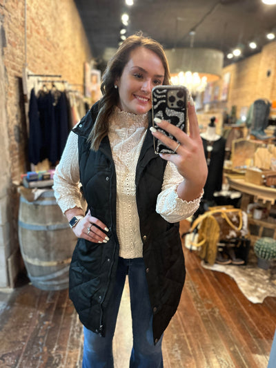 Broker Leather Employee Selfie modeling our Halsey Long Puffer Quilted Vest [Black].