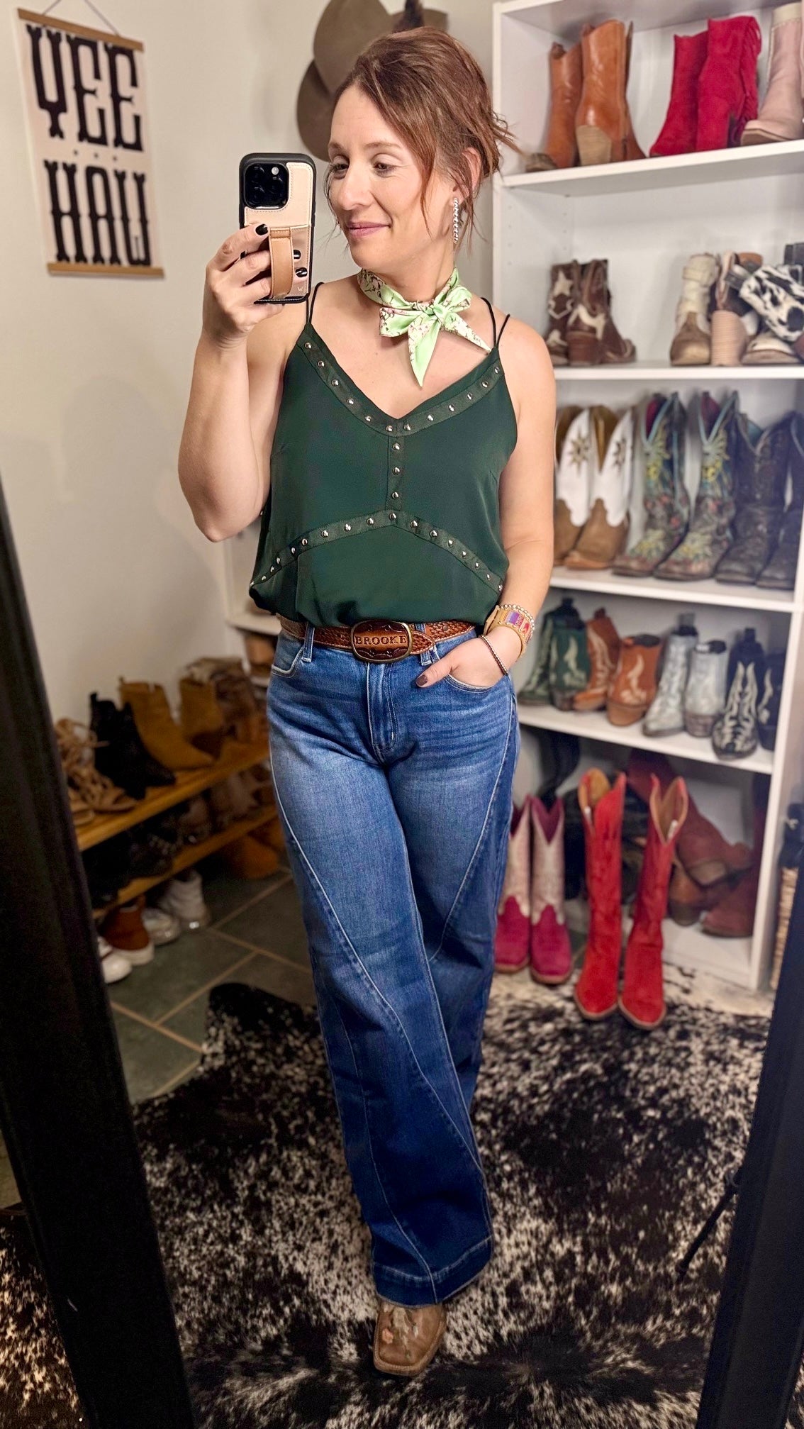 Western-inspired green tank top with double strap design and studded detailing for a statement look.