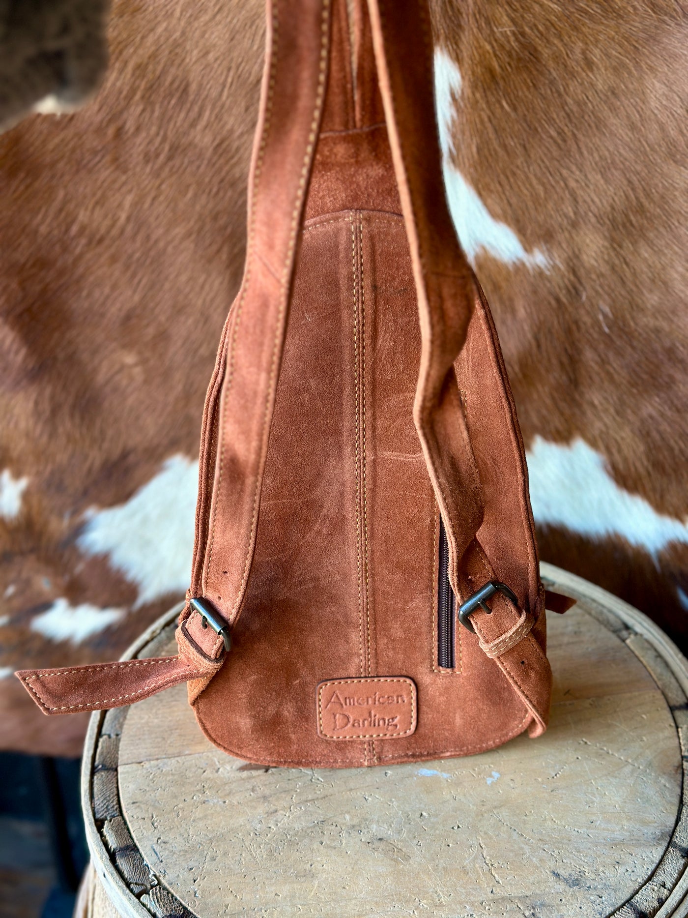 Back View of Hildy Suede Leather Backpack with Zippered Pocket.