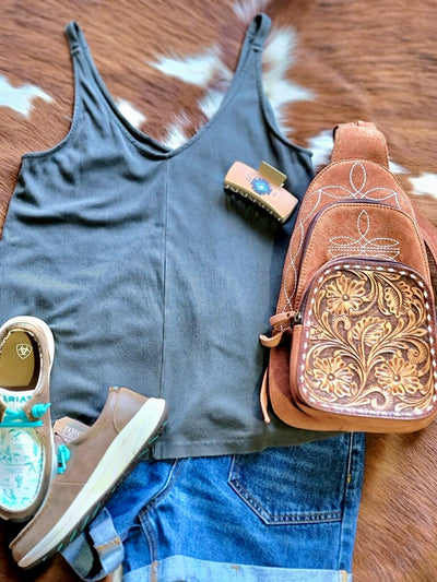 Outfit inspiration from Broker Leather featuring a basic tank top, Ariat Hilos, and the Hildy Suede Leather Backpack with Stitched Details and Tooled Accents.