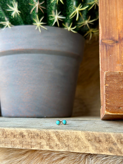 Authentic turquoise studs in sterling silver, measuring approximately 4mm in diameter, offering subtle southwestern charm.