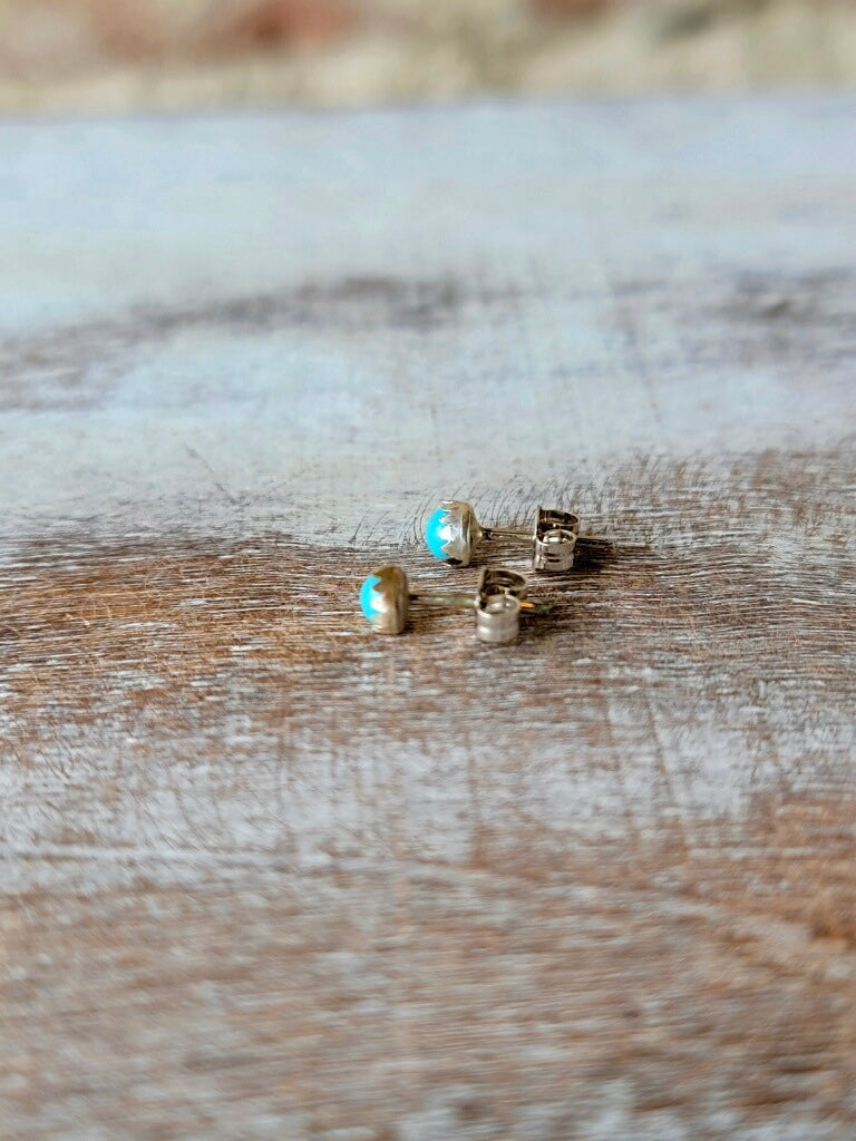 Side View of Tiny Turquoise Stud Earrings Highlighting Craftsmanship.