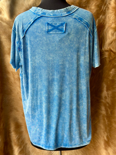Back view of oversized ribbed top with subtle shoulder detail.