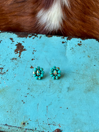 Close-up of Janel Clay Cluster Earring [Turquoise], handmade with polymer clay and painted to resemble turquoise stones.