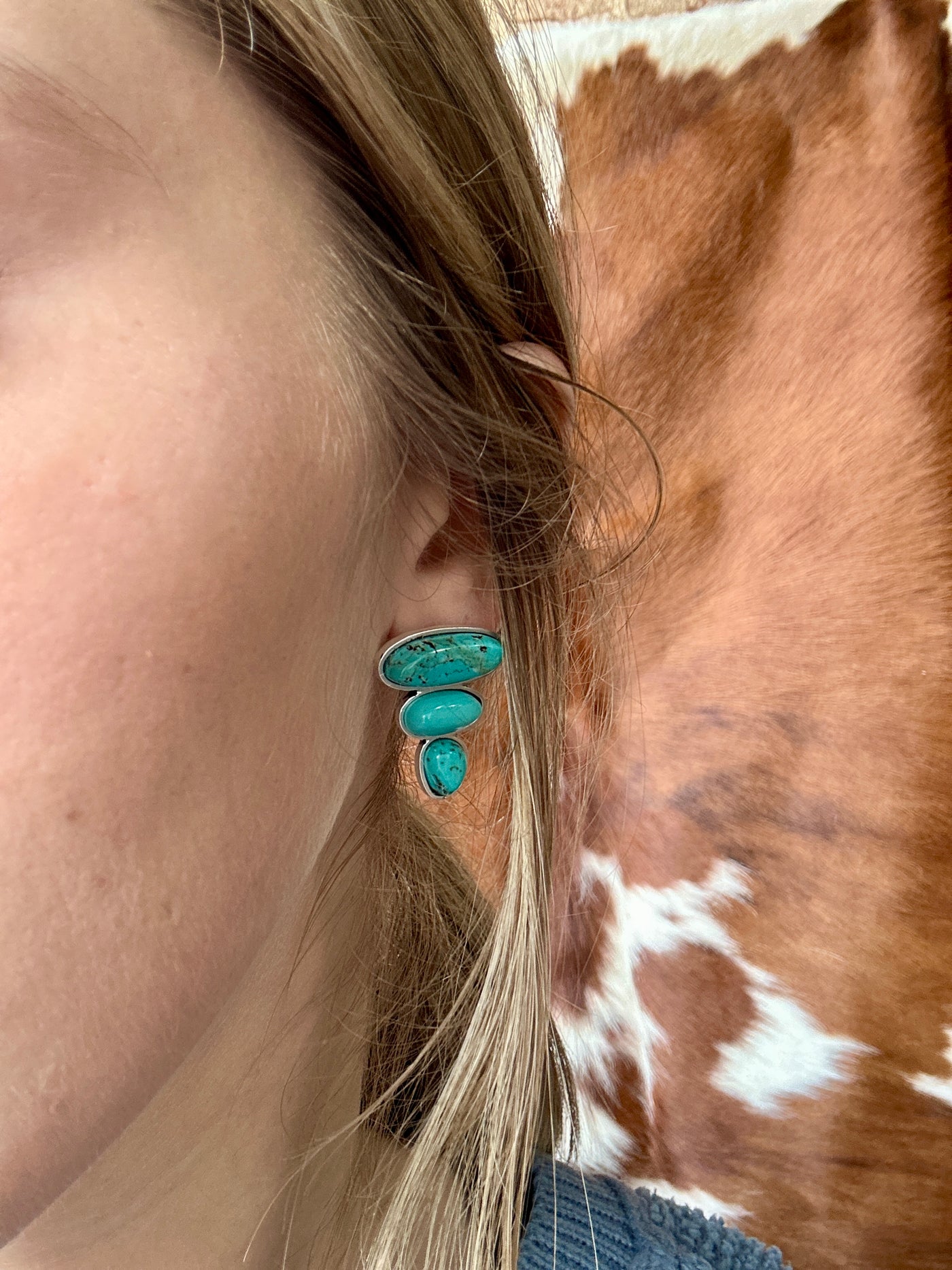 Close-up of the Jeep Turquoise Stud Earrings, showcasing the vibrant faux turquoise stones and antique silver setting.