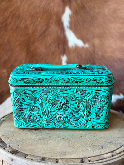 Genuine leather cosmetic case features intricate tooling & dyed a beautiful aqua turquoise color, perfect for organizing your beauty essentials.