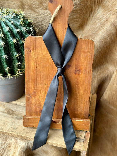 Black polyester twilly with silky texture and sleek design.