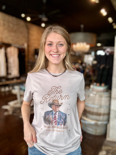 A woman modeling the new Joram Cowboy Trump Graphic Tee- a perfect Christmas gift for American Republicans.