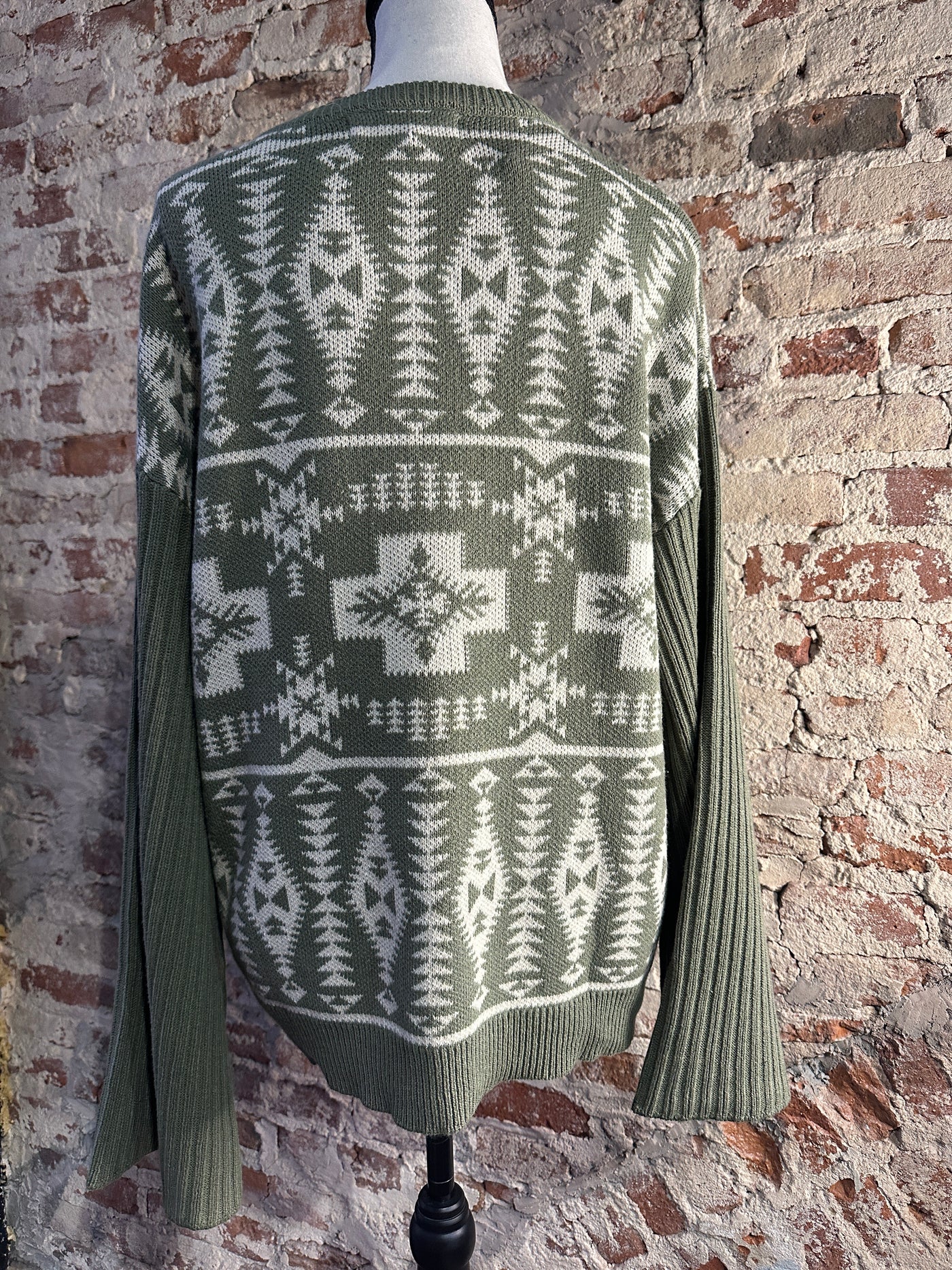 Full view of the Juda Sweater, ideal for adding a touch of personality to your wardrobe with its unique pattern and sleeve design.