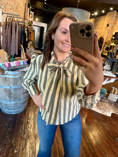 Close-up of Kallyn Striped Bowtie Blouse bowtie detail and chic collared neckline.