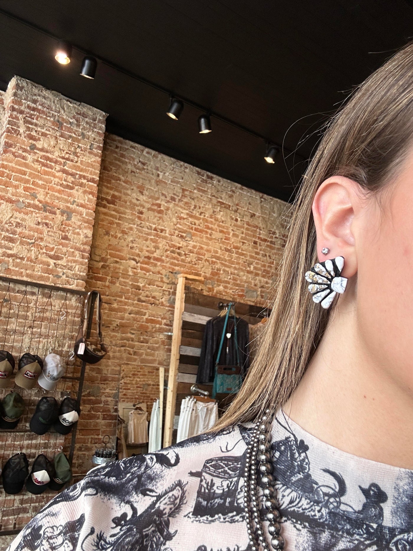 Model wearing the Kelcie Clay Cluster Earrings for size relevance, styled for a bold Western-inspired statement look.