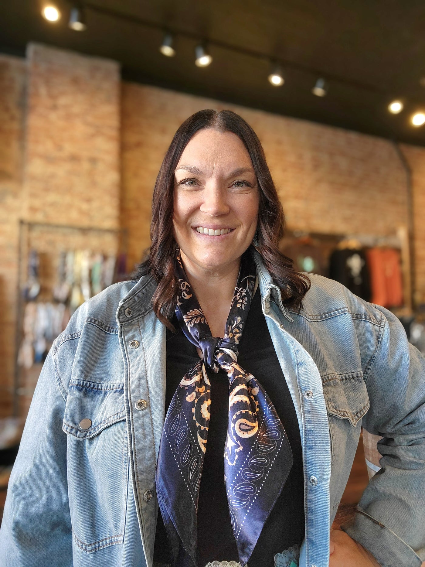 Woman modeling our Kiersten Navy Paisley Wild Rag.