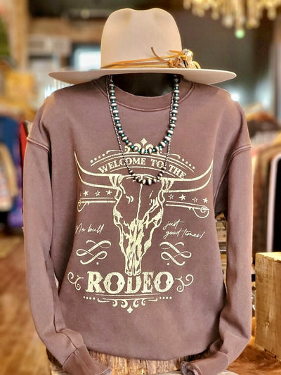 Brown mineral-washed rodeo sweatshirt with vintage Western style.