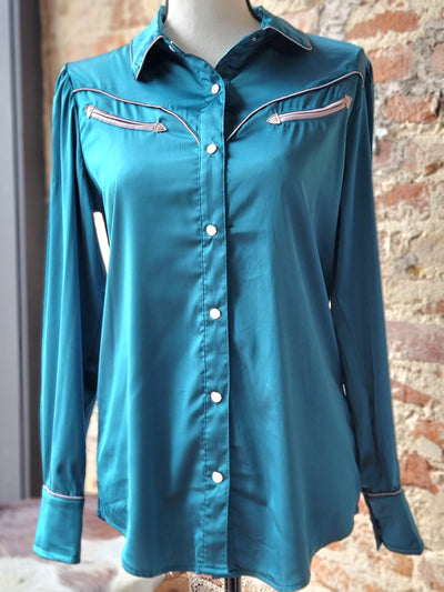 Close-up of Lacey Turquoise Western Yolk Pearl Snap Top showcasing turquoise hue and satin feel fabric.