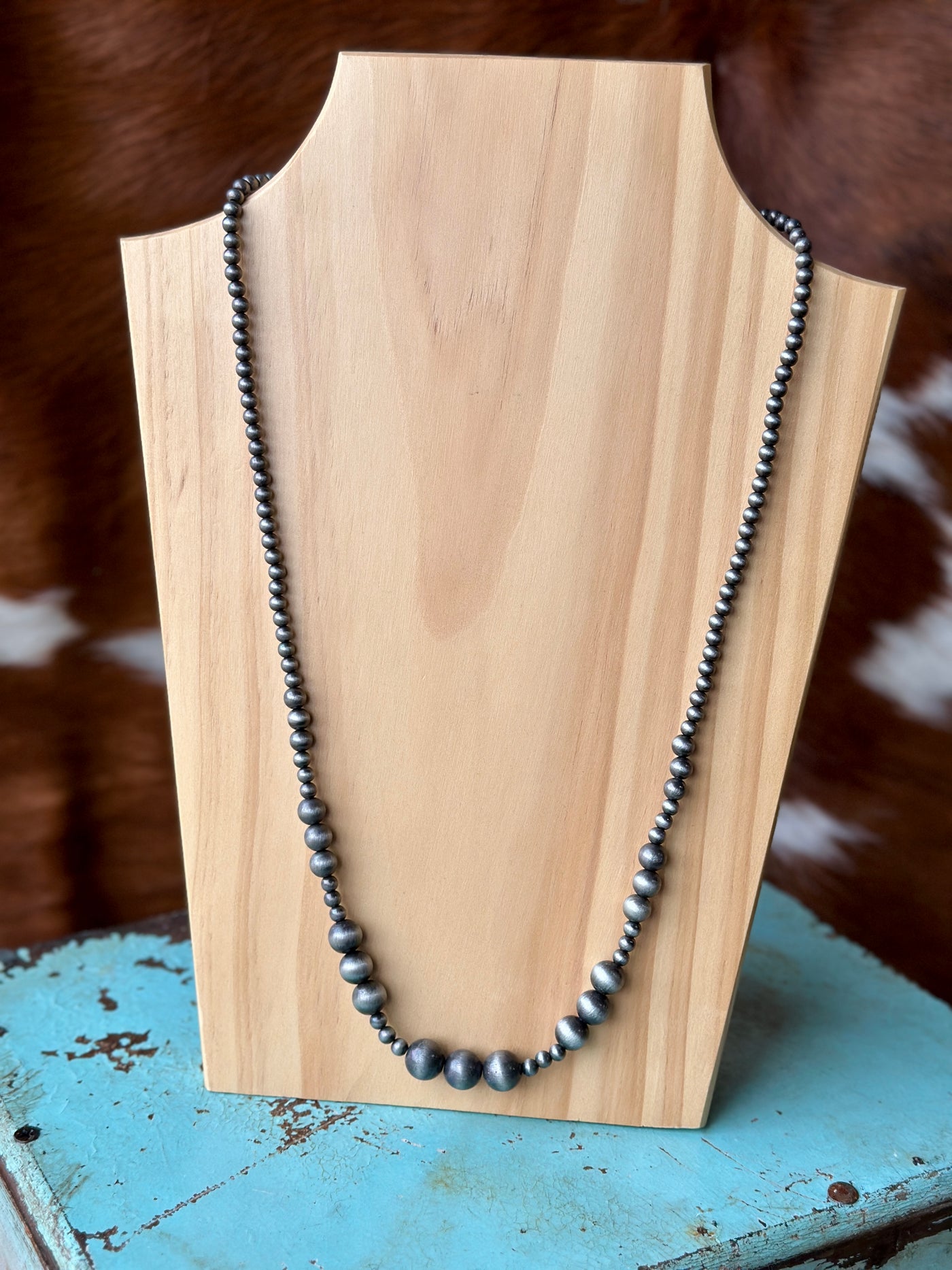 Lakin Navajo Pearl Necklace featuring faux Navajo beads in sizes 6mm to 14mm, with a 5" extender, showcasing Western elegance and timeless style.