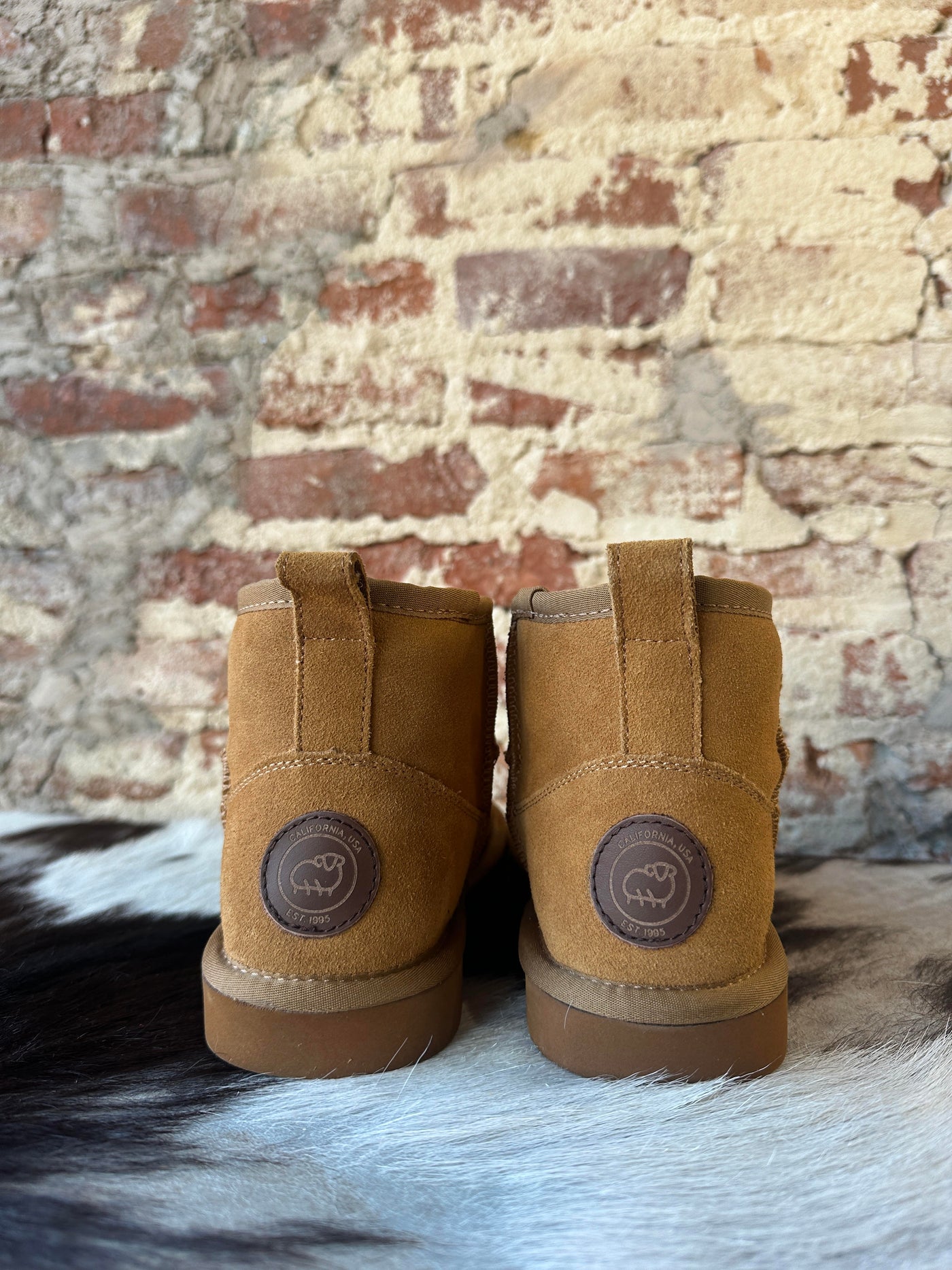 Back side View of our Lamo Kora Moccasin Mini Boots.