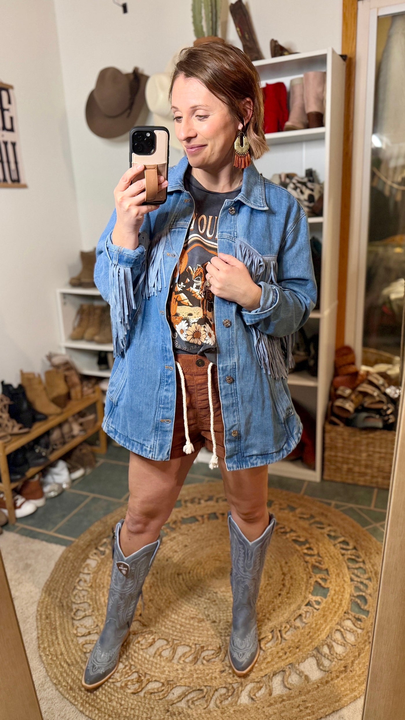 Lightweight Cotton Denim Jacket with Classic Cowgirl Flair and Ariat Casanova boots modeled by Broker Leather employee, Brooke.