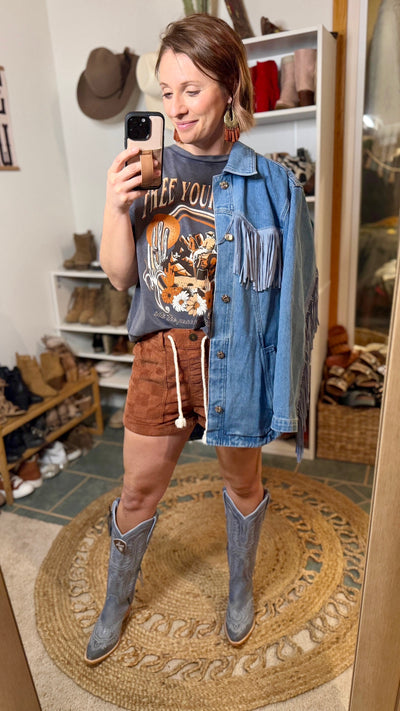 Western-Inspired Denim Fringe Jacket Styled with a Graphic Tee and Denim Ariat Casanova Boots.