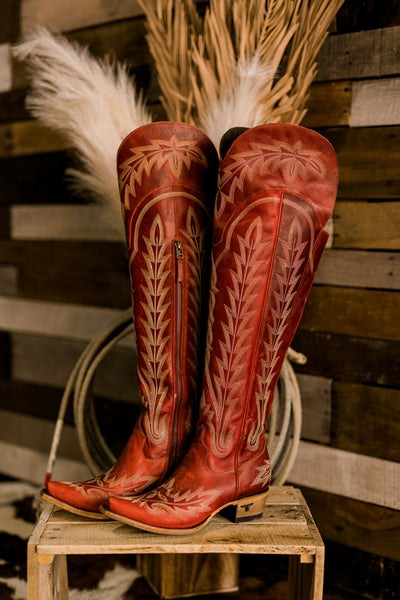 The most gorgeous, traditional boot stitch pattern on the Lane Lexington Over-the-Knee Boots in smoldering ruby red.