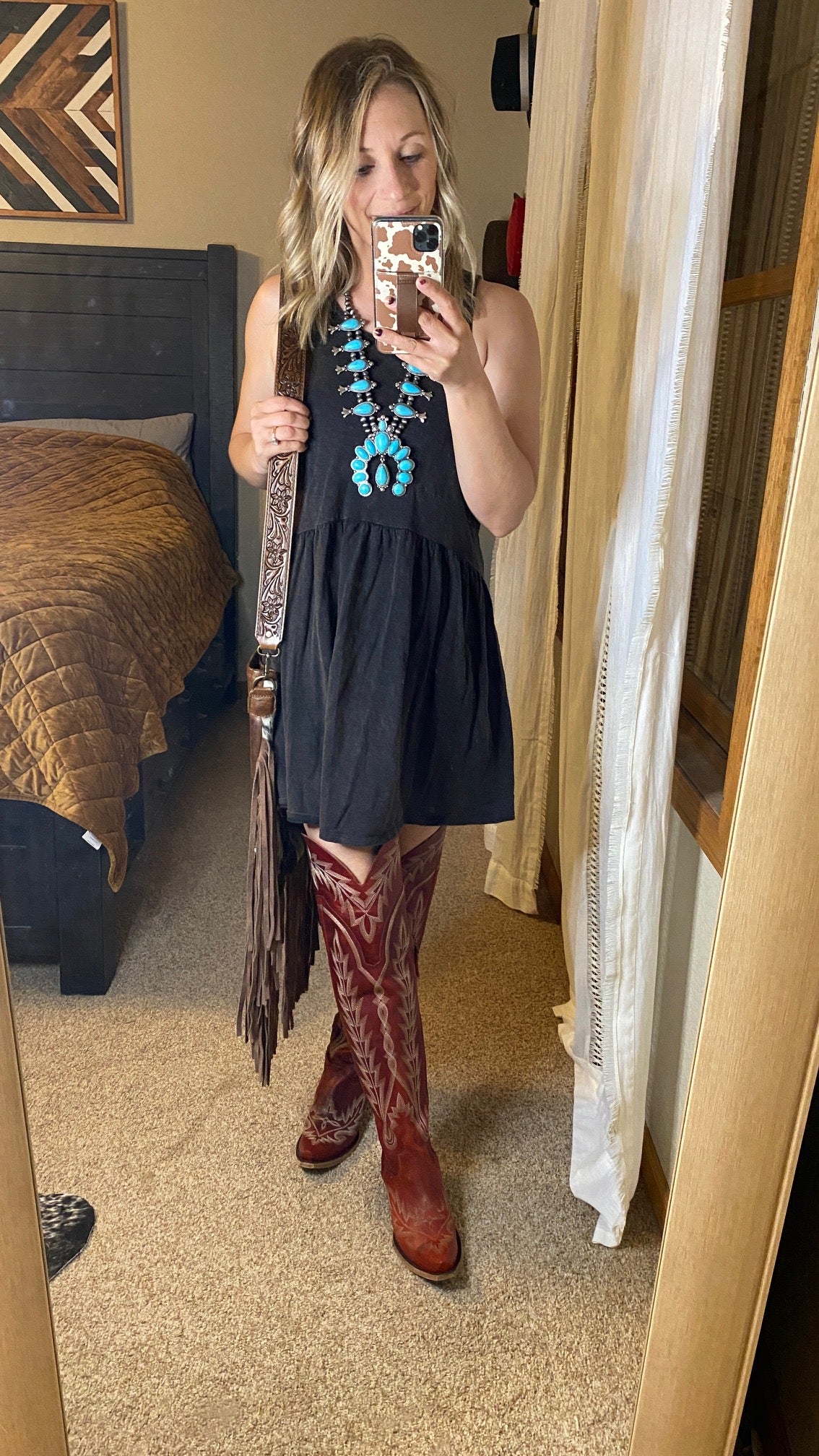 A black dress, turquoise squash blossom, and Lane Lexington Over-the-Knee Boots [Smoldering Ruby] make for the perfect NFR outfit.