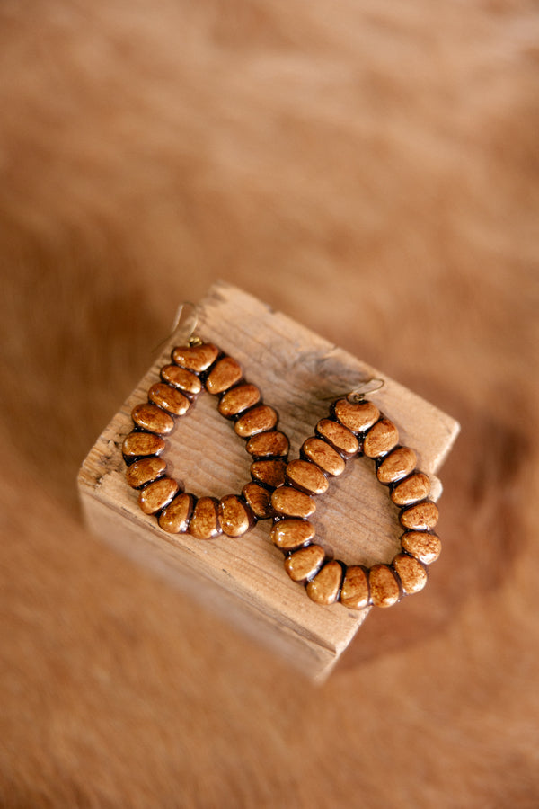 Latigo Clay Teardrop Earrings – handcrafted polymer clay earrings designed to resemble white buffalo stone.