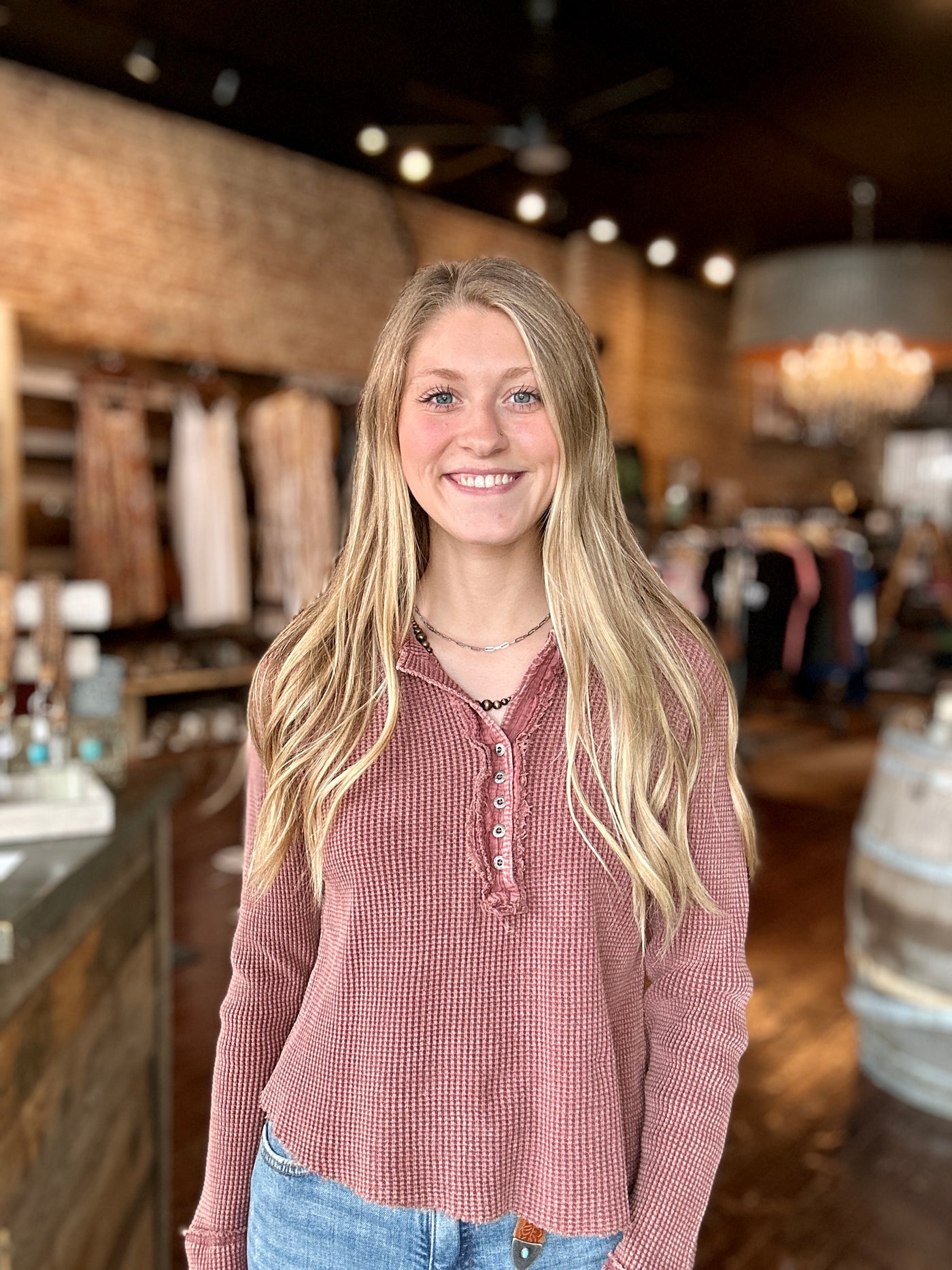 Grace modeling the Lillian Waffle Knit Button-Up Top with a pair of jeans for a cozy fall outfit.