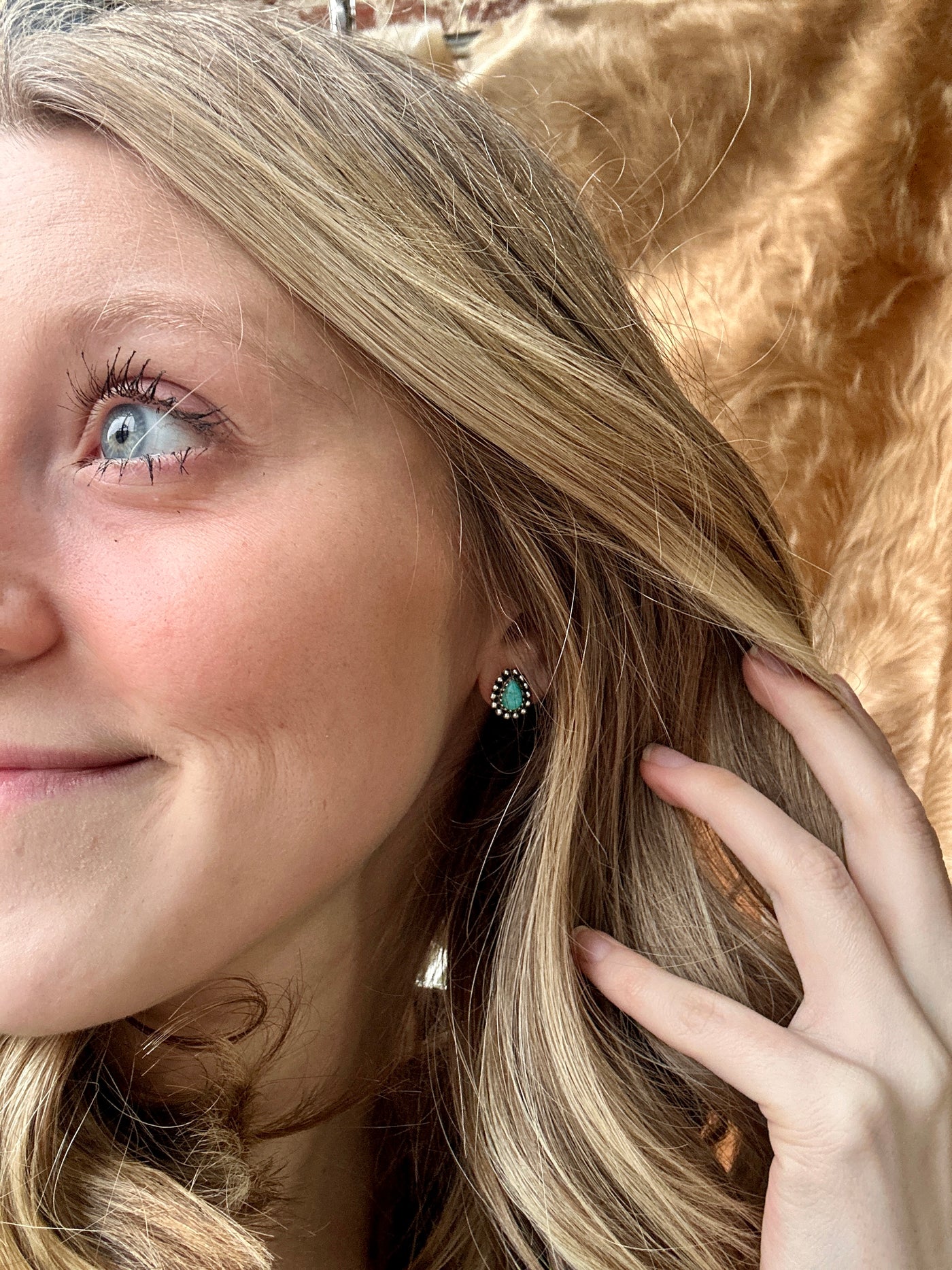 Western-Inspired Lindsay Turquoise Earrings – Perfect for Everyday Wear or Special Occasions modeled by staff to show size relevance.