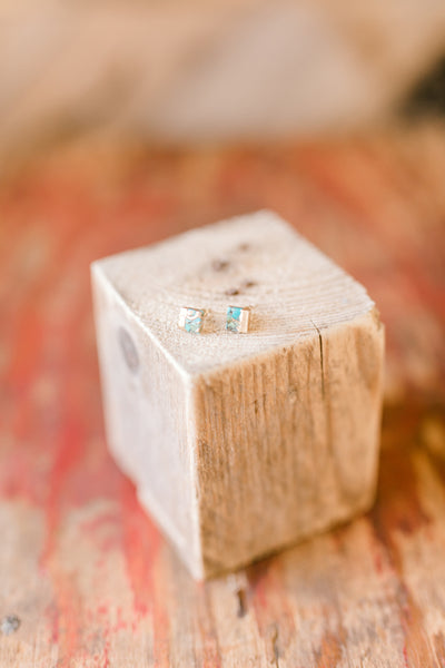 Elegant turquoise and gold stud earrings styled for everyday wear and gifting