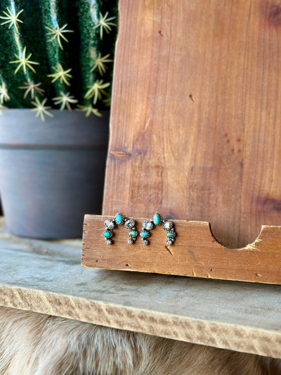 Handcrafted Lovella Squash Blossom Earrings with authentic turquoise, offering a timeless Southwestern style.