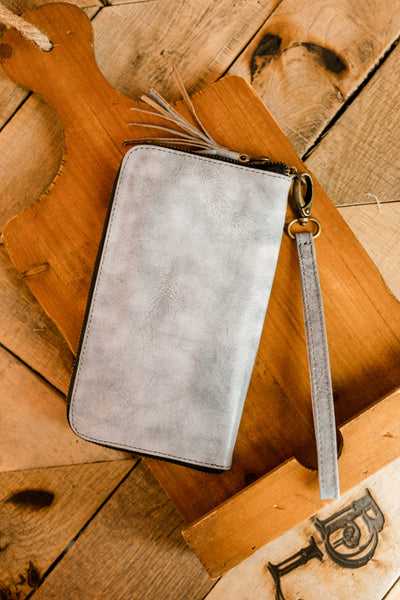 Close-up rear view of bone leather wristlet showcasing handcrafted genuine leather.